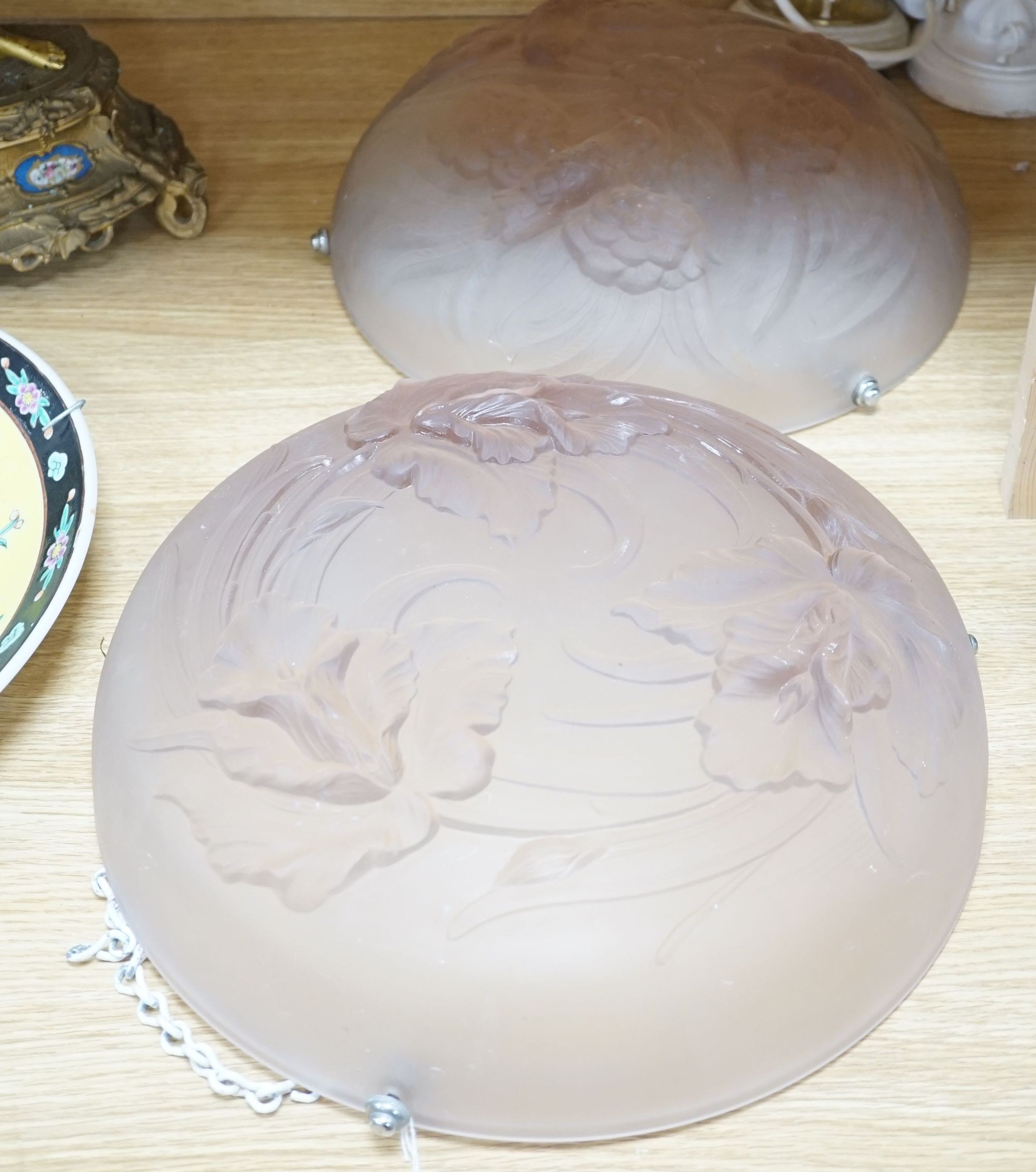 Two 1930s pink frosted glass plafonnier lights, one decorated with birds the other flowers, 36 cms diameter.